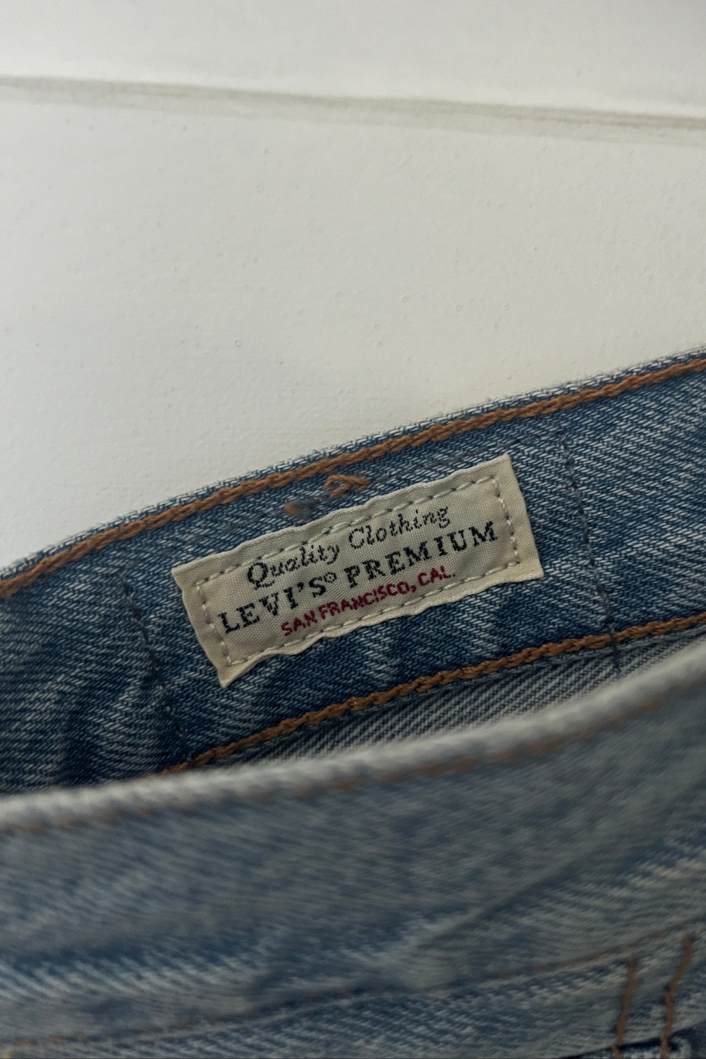 Levi's Premium label on a denim garment with a white background